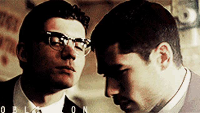 two men are looking at each other and the word oblivion is on the bottom left