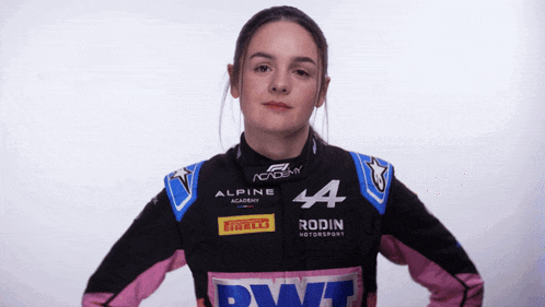 a woman wearing a black and pink alpine jacket