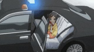 a girl is sitting in the back seat of a car .