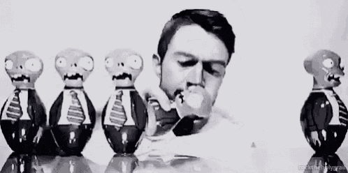 a black and white photo of a man shaving his beard surrounded by plants vs zombies figurines .