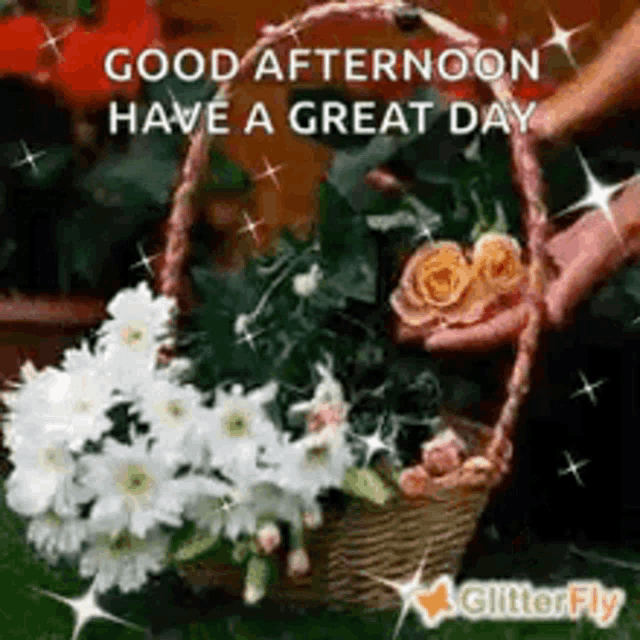 a picture of a person holding a basket of flowers with the words `` good afternoon have a great day '' .