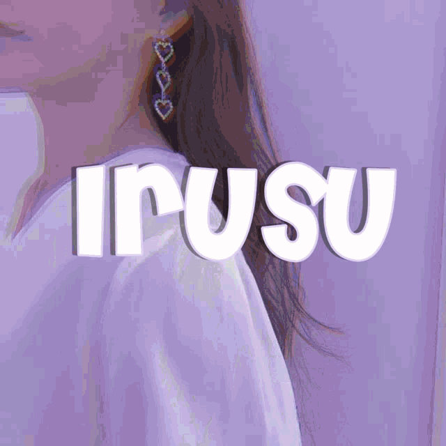 a woman wearing a white shirt and earrings with the word irusu on it