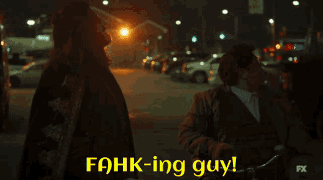 a blurred image of people walking down a street with a fx logo behind them