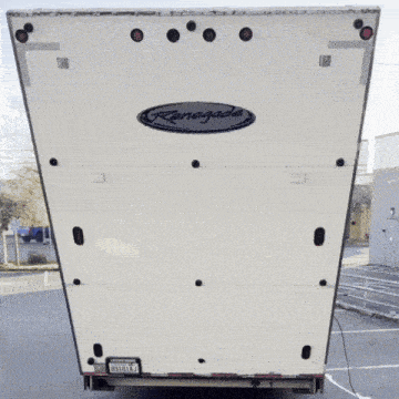 the back of a white renegade trailer with a california license plate