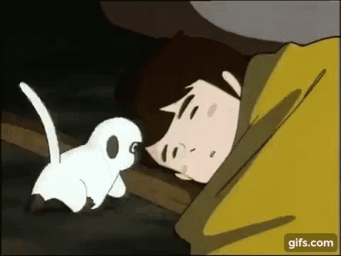 a cartoon of a man sleeping next to a small white cat .