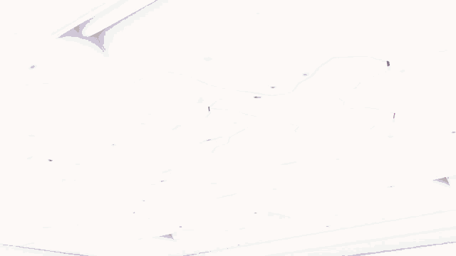 a girl in a maid outfit is laying on the floor in an office