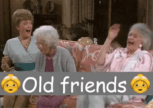 three older women are sitting on a couch with a sign that says old friends on it
