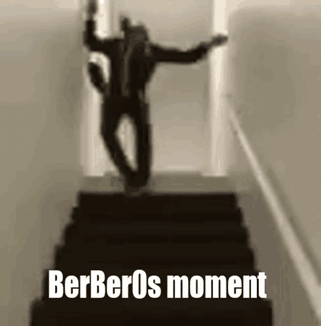 a man is walking down a set of stairs with the words berberos moment below him