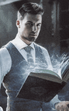 a man in a suit and tie is holding a book with the word wizard on it