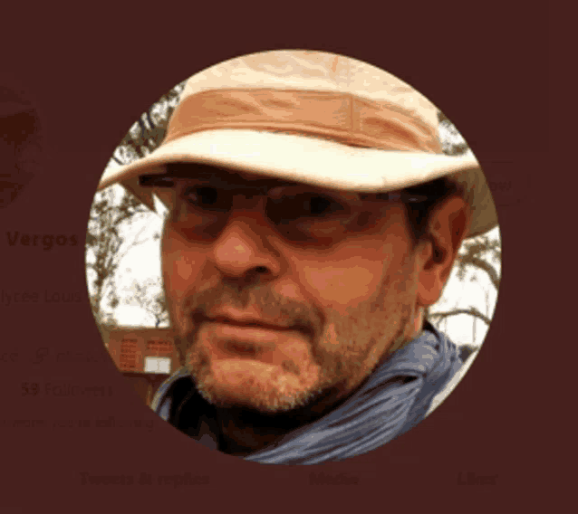 a man wearing a hat and glasses is featured on a twitter page