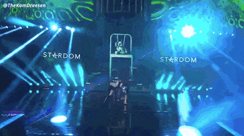 a person in a chair on a stage that says stardom on it