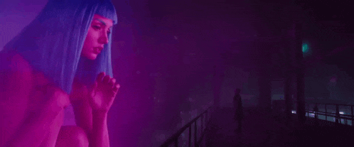 a woman with blue hair is holding a bottle with the words " you look thirsty " on the bottom