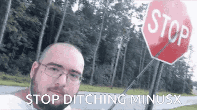 a man stands in front of a stop sign with the words stop ditching minusx above him