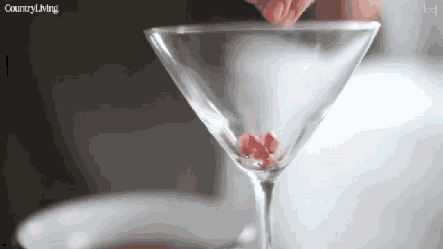 a martini glass with a country living logo on it