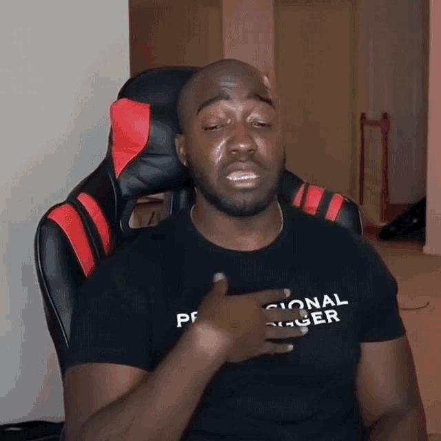 a man wearing a shirt that says personal danger is crying