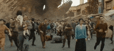 a group of people running down a street with a sign that says ' a '