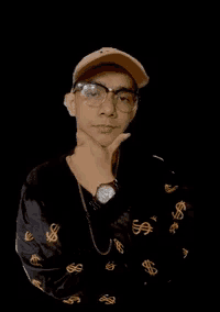 a man wearing glasses and a hat is standing in front of a black background that says " masih gua liatin "