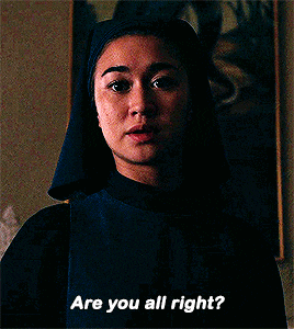 a nun says are you all right in front of a painting