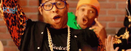 a man wearing glasses and a necklace that says hooice
