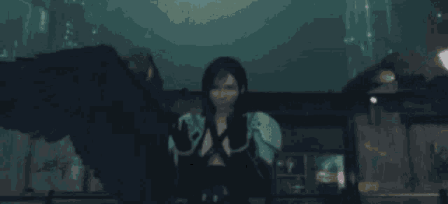 a woman with black wings is standing in front of a building in a video game .