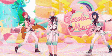 three anime characters are dancing on a stage in front of a sign that says chocolate magic .