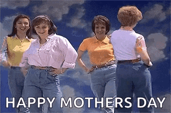 a group of women are standing next to each other in front of a blue sky .