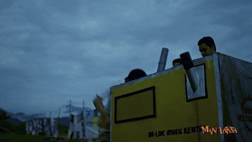 a man is standing in a box that says hi-lok music rent