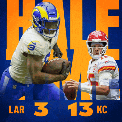 a rams player holding a football next to a kc player