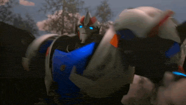 a robot with blue eyes is standing in front of trees .