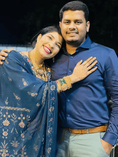 a man and a woman are posing for a picture together