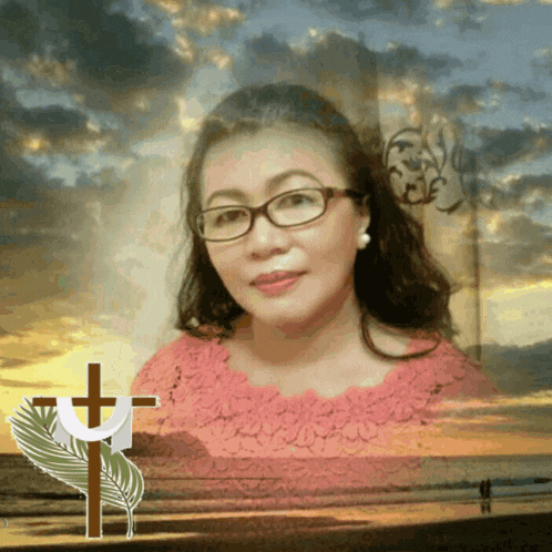 a woman wearing glasses stands in front of a cross and a palm leaf