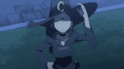 a witch wearing glasses and a hat with a letter c on it