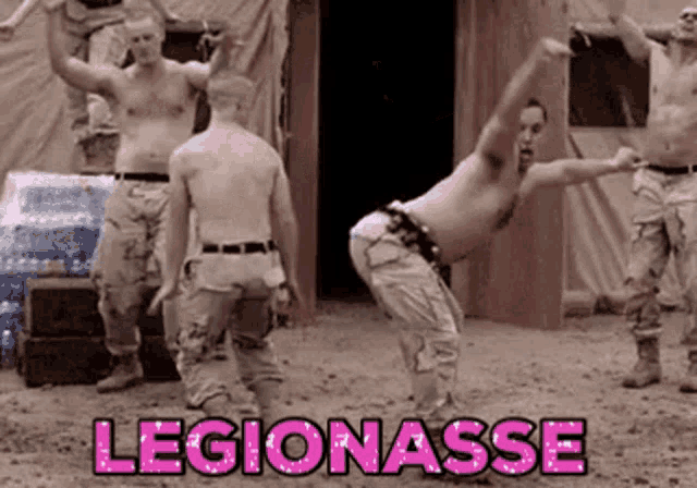 a group of men are dancing in the dirt with the word legionasse in pink