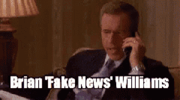 a man in a suit and tie is talking on a cell phone with the caption brian fake news williams .