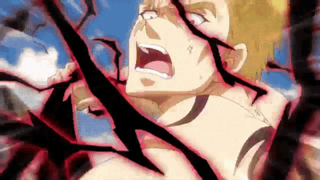 a man with a tattoo on his chest is being attacked by a giant monster .