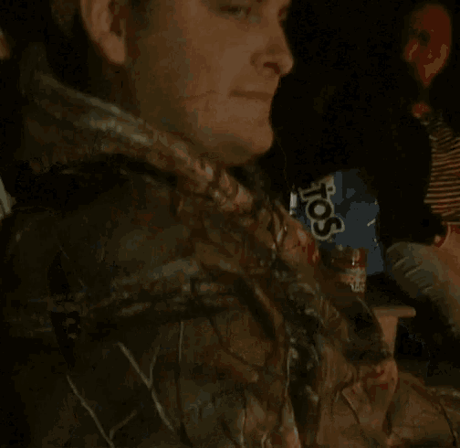 a man sitting in a chair with a box of doritos in the background says hey sup sex man