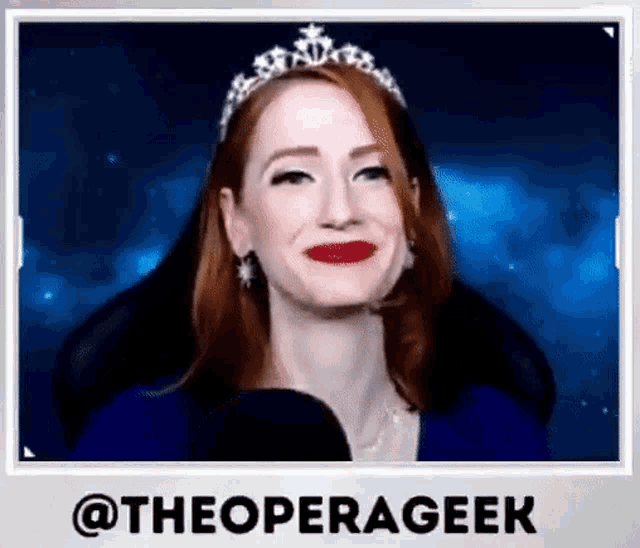 a woman with red hair wearing a tiara and red lipstick is smiling .