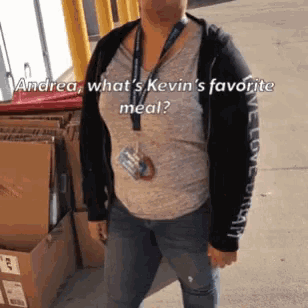a woman wearing a lanyard with the words andrea what 's kevin 's favorite meal