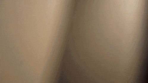 a blurred image of a wall with a few spots of light on it