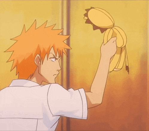 a man with orange hair is holding a stuffed animal with a lion face