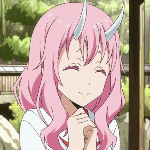 a girl with pink hair and horns is smiling for the camera