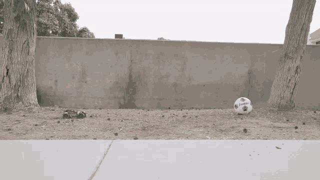 a soccer ball with the word umbro on it is on the ground