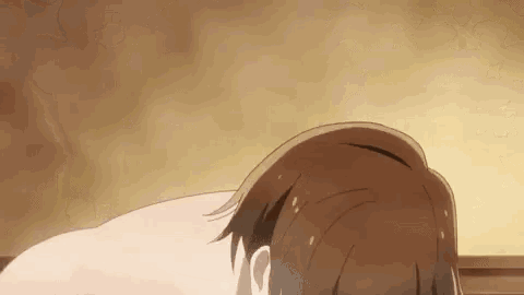 a man is taking a bath in a bathtub with steam coming out of his head .