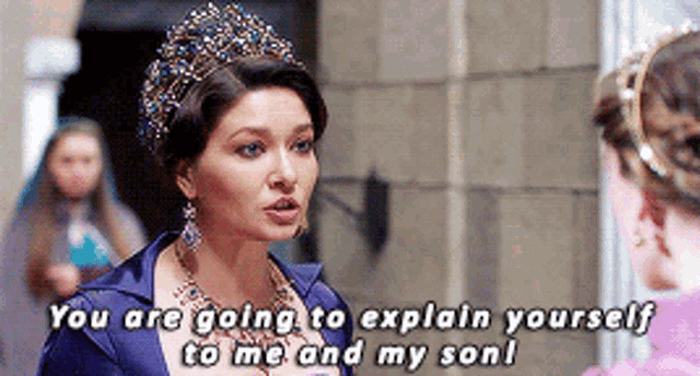 a woman wearing a tiara is talking to another woman and says you are going to explain yourself to me and my son !