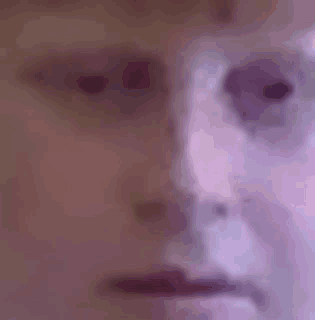 a close up of a person 's face with purple eyes and a purple background .