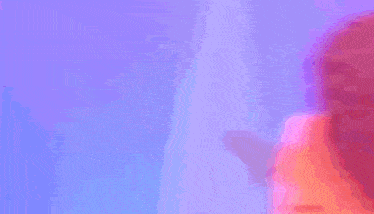 a blurry picture of a woman 's face with long red hair