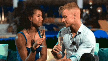 a man and a woman drinking champagne together