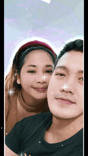 a man and a woman posing for a picture together