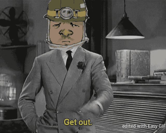 a man in a suit says get out in a gif