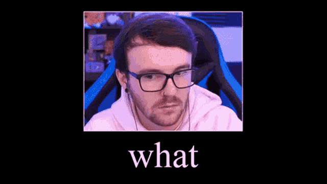 a man wearing glasses and headphones is sitting in a chair with the word what on the bottom .